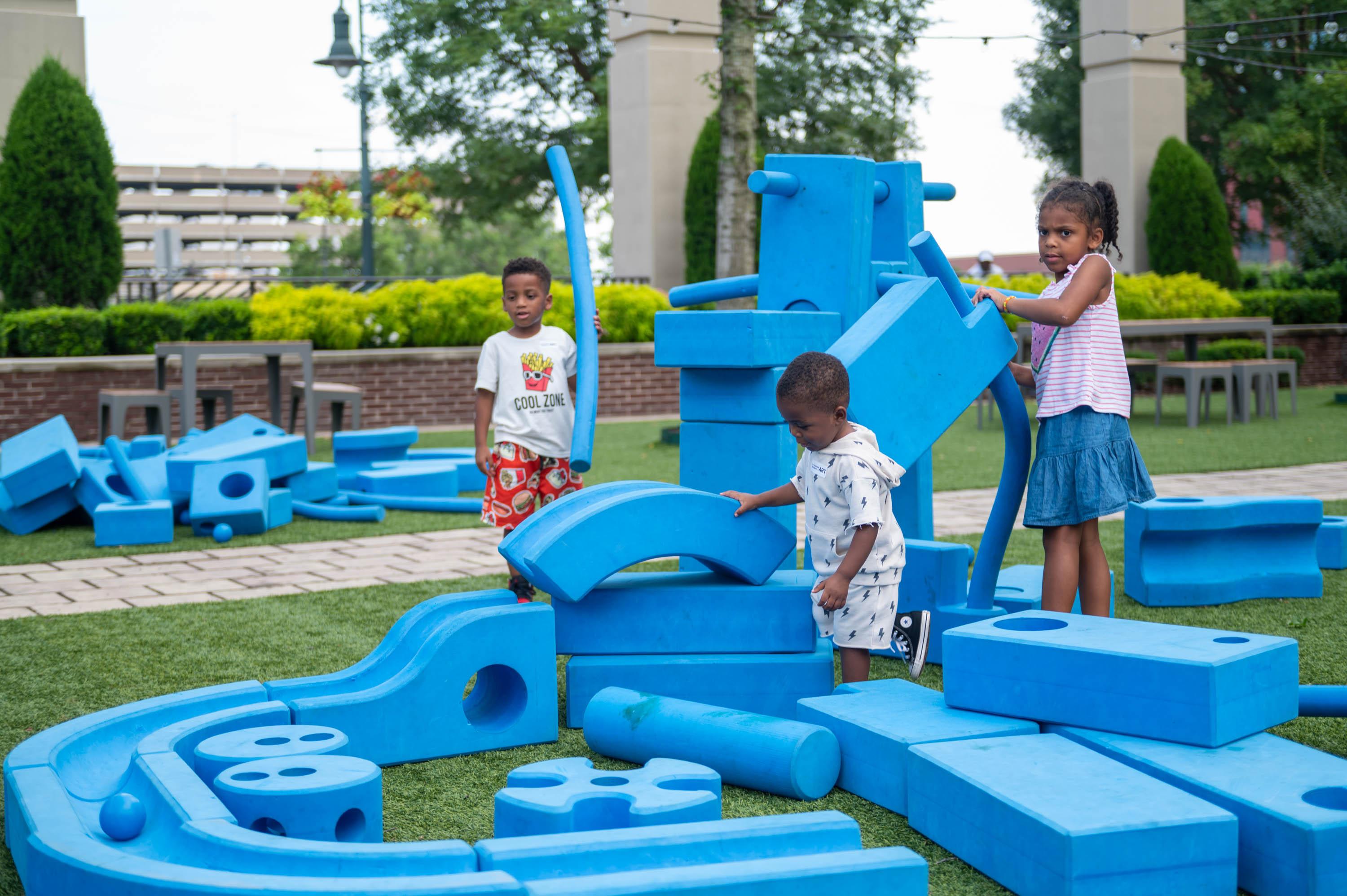 children playing on boyd plaza