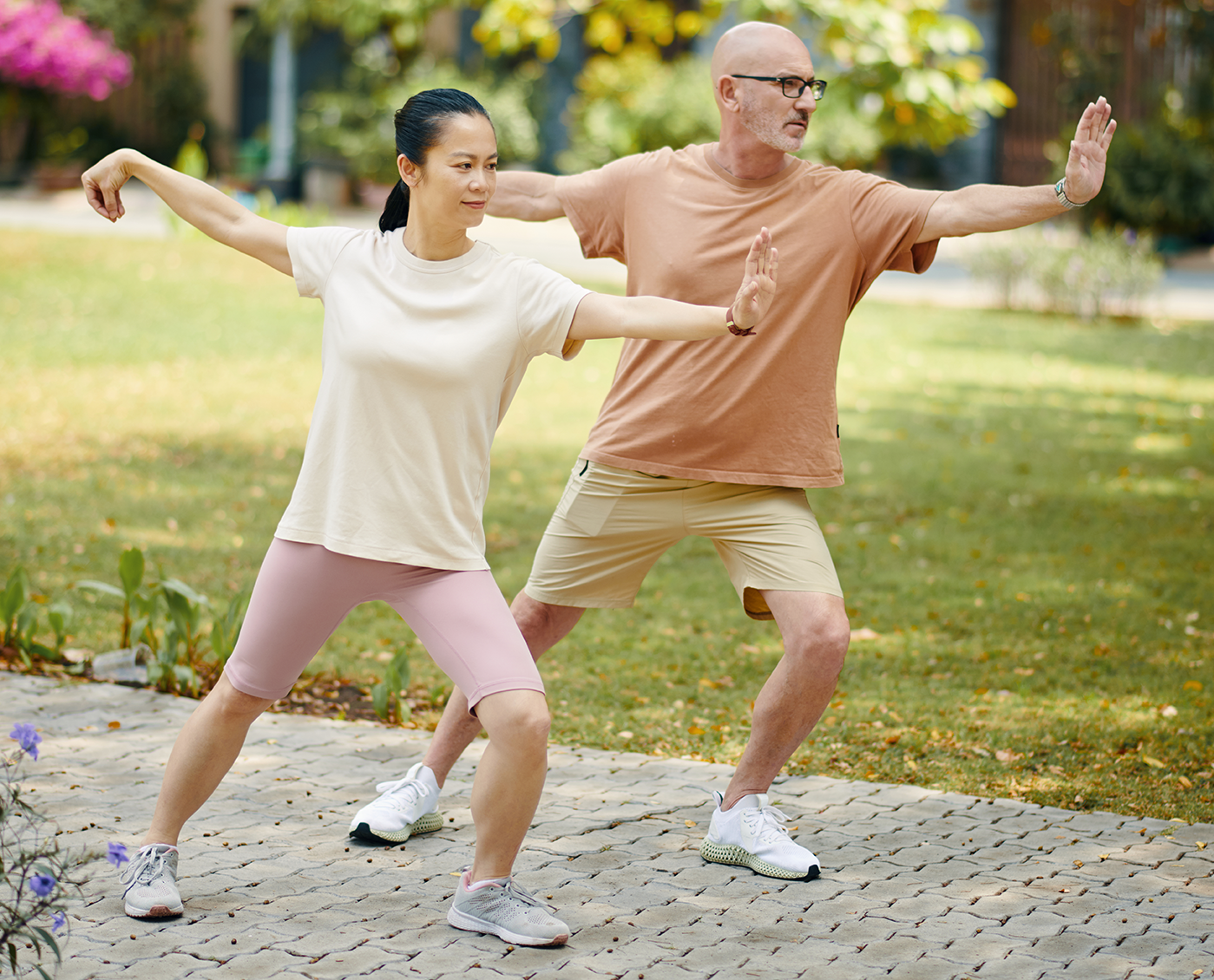 two people in Tai Chi poses outside