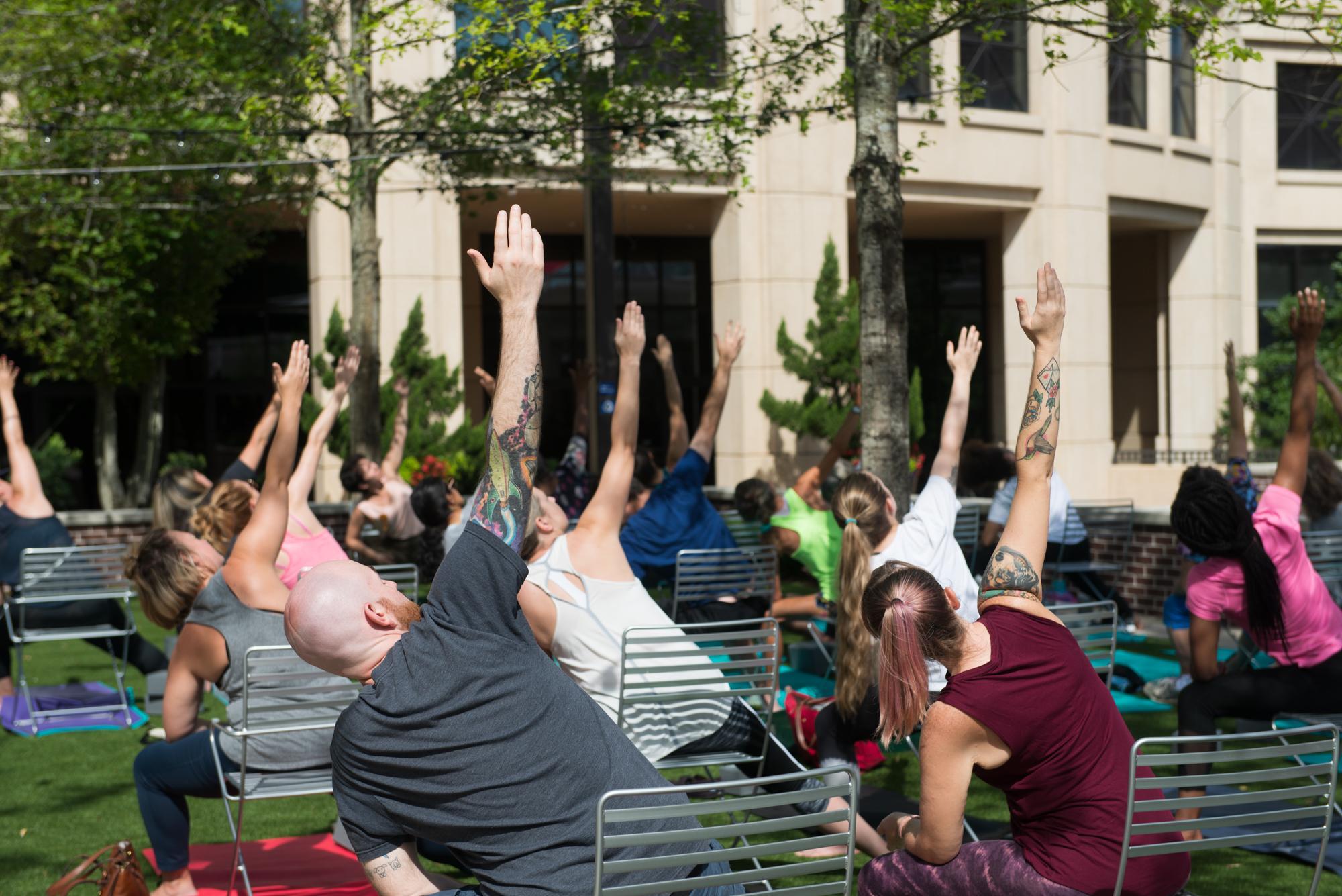 A yoga class on Boyd Plaza
