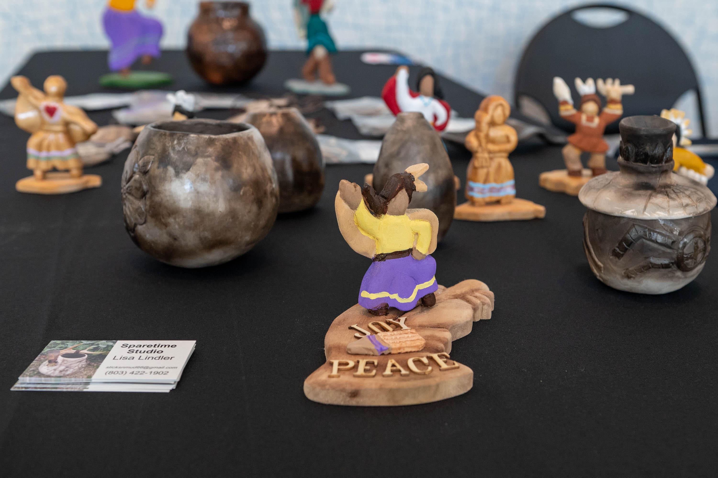 Small figurines for sale on a table