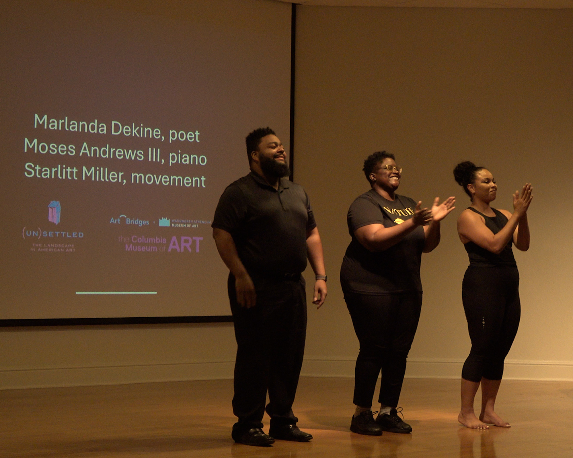 Dekine, Andrews, and Miller onstage