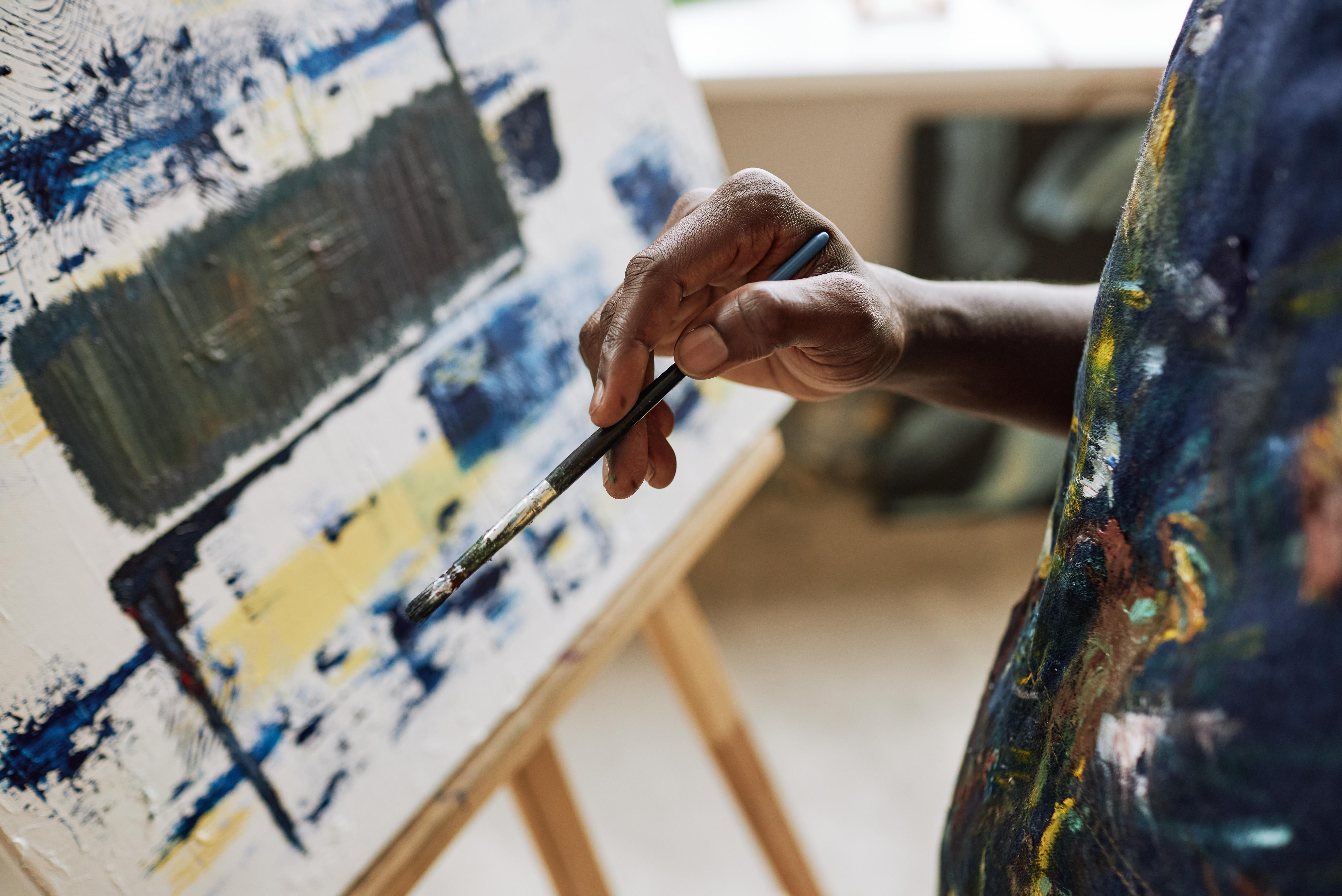 a person working on an abstract painting