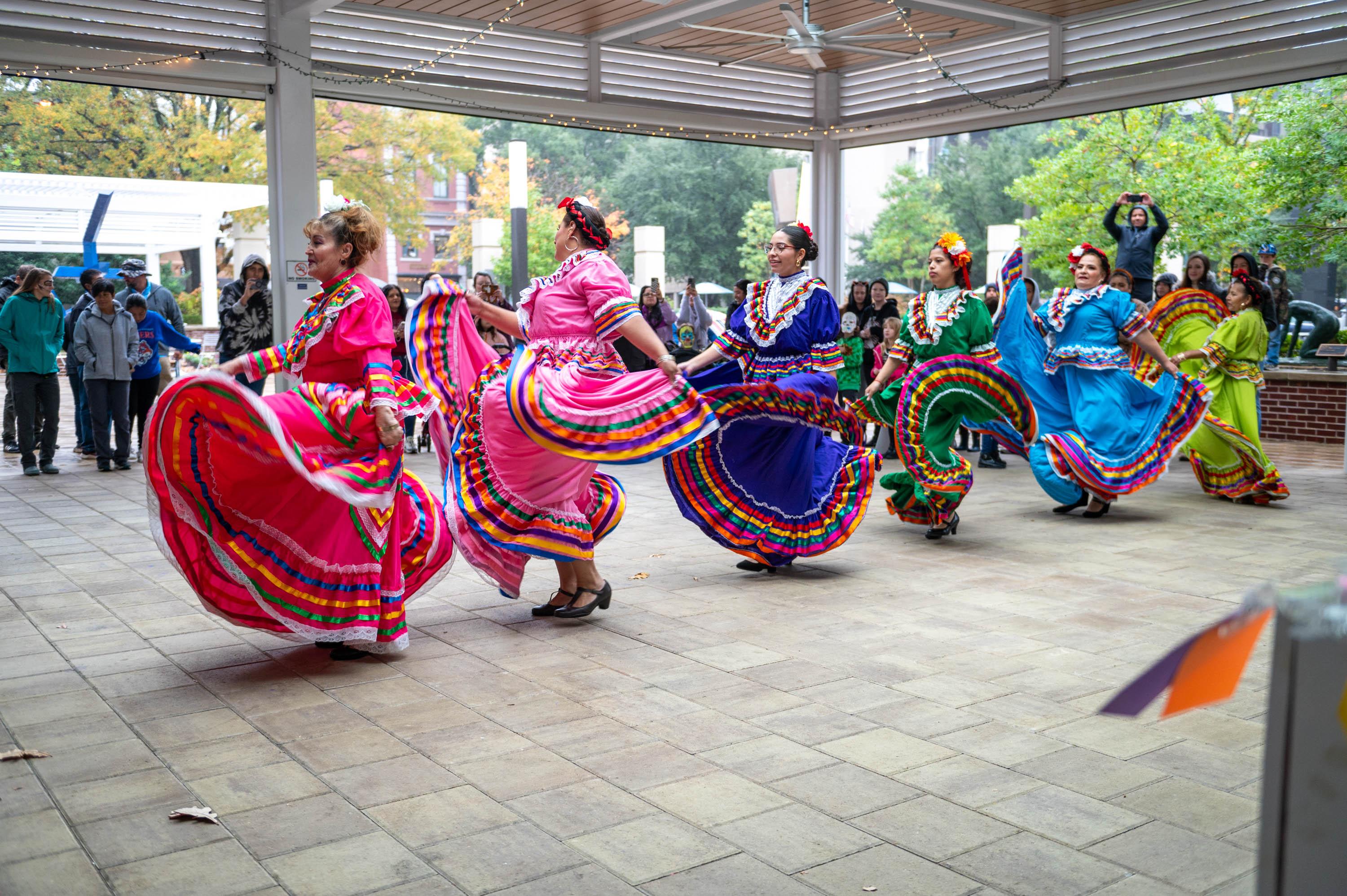 dancers in colorful dresses