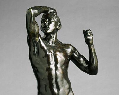 bronze statue of a nude man by Rodin