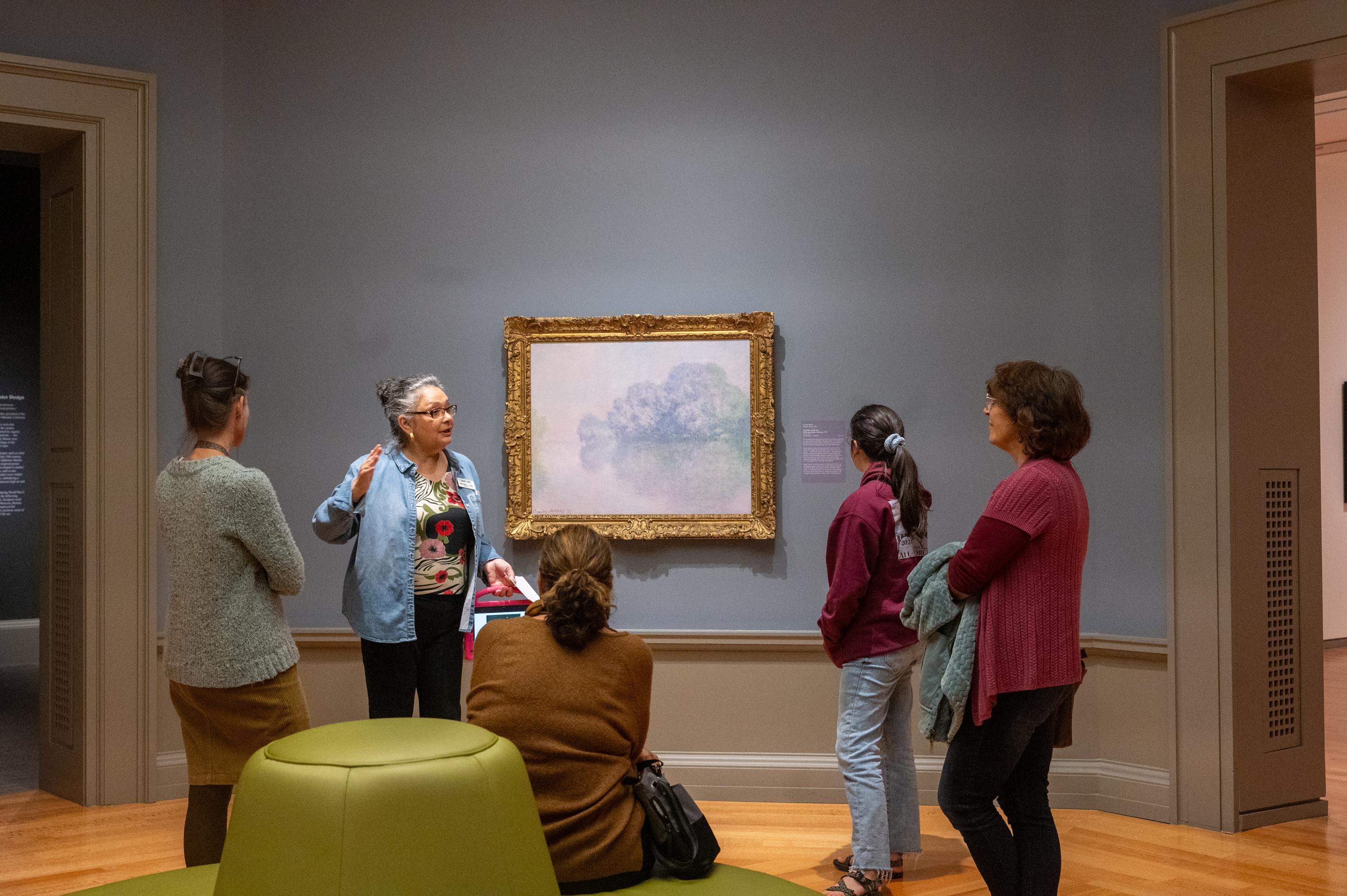 visitors on tour in Collection Gallery with Docent