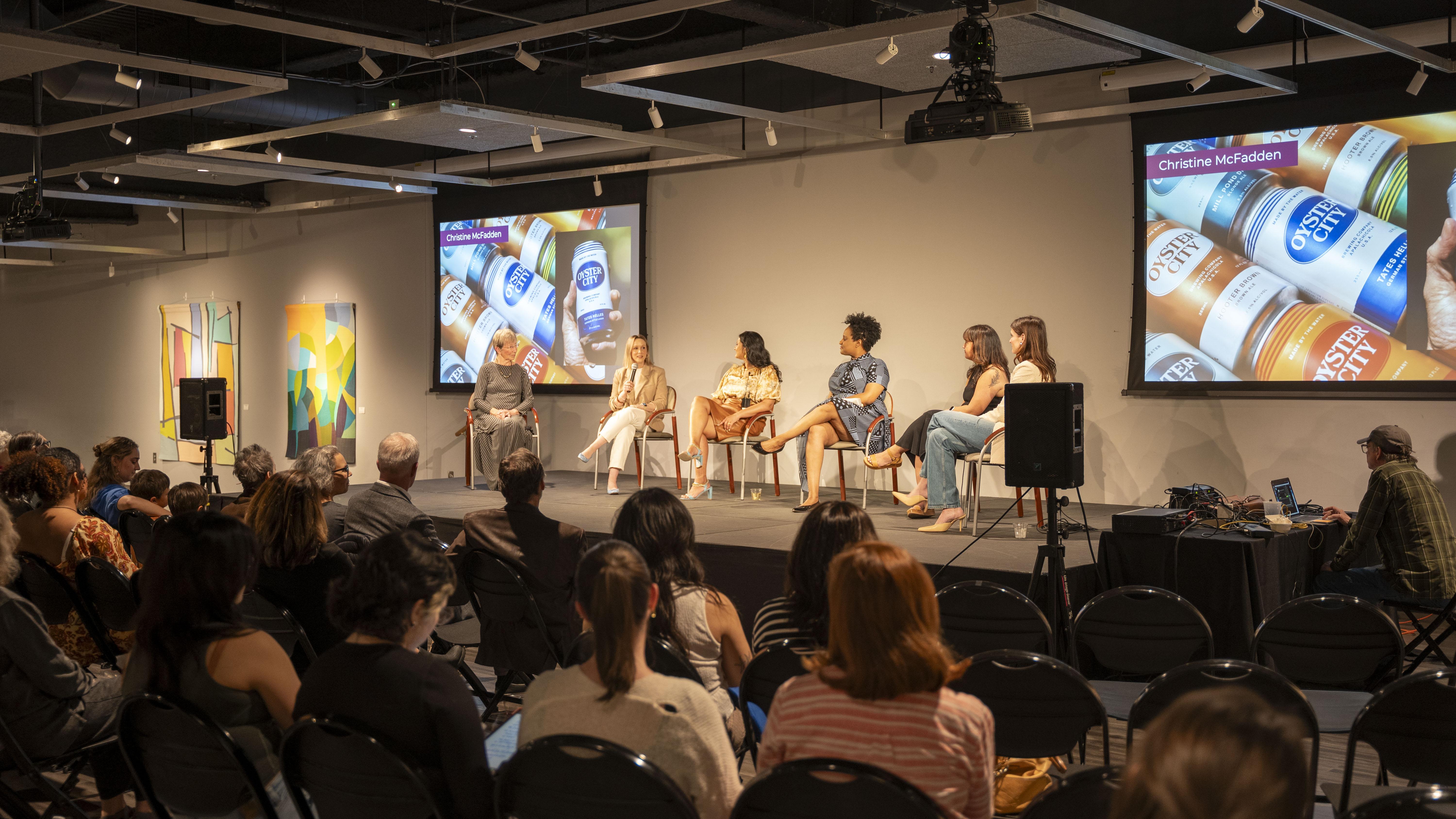 a panel of women on stage