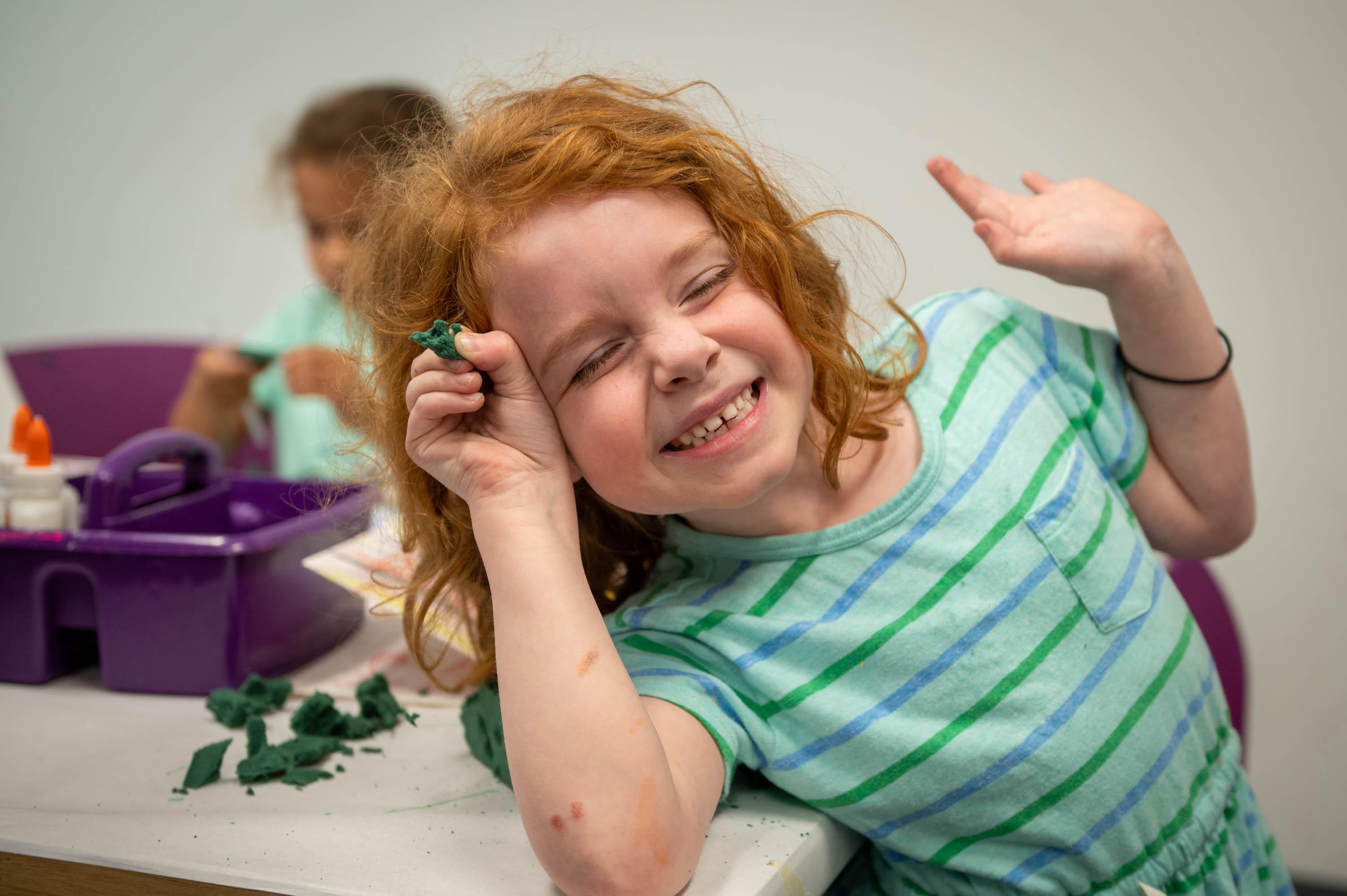 child smiling in summer camp