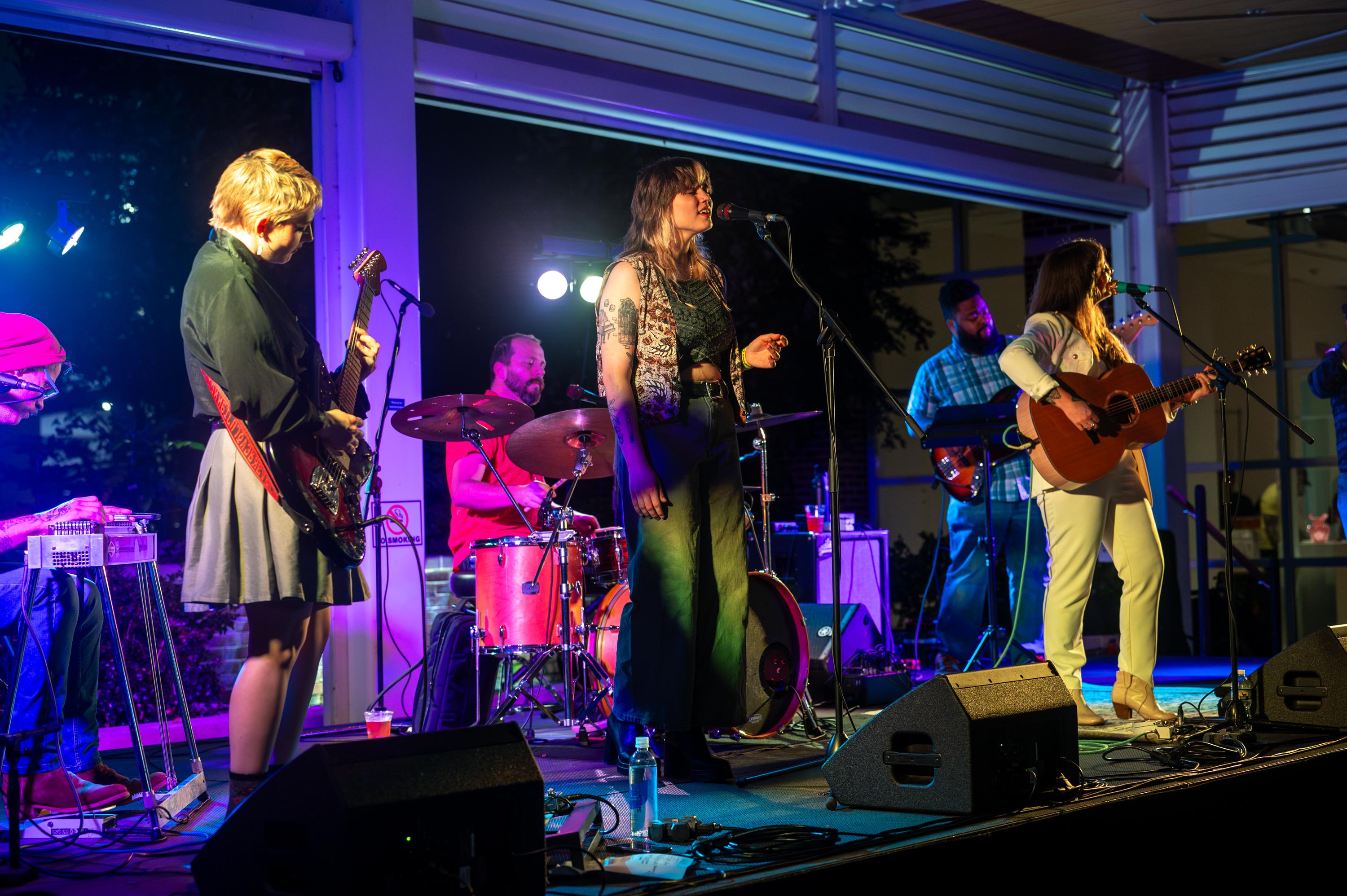 a band performing on Boyd Plaza