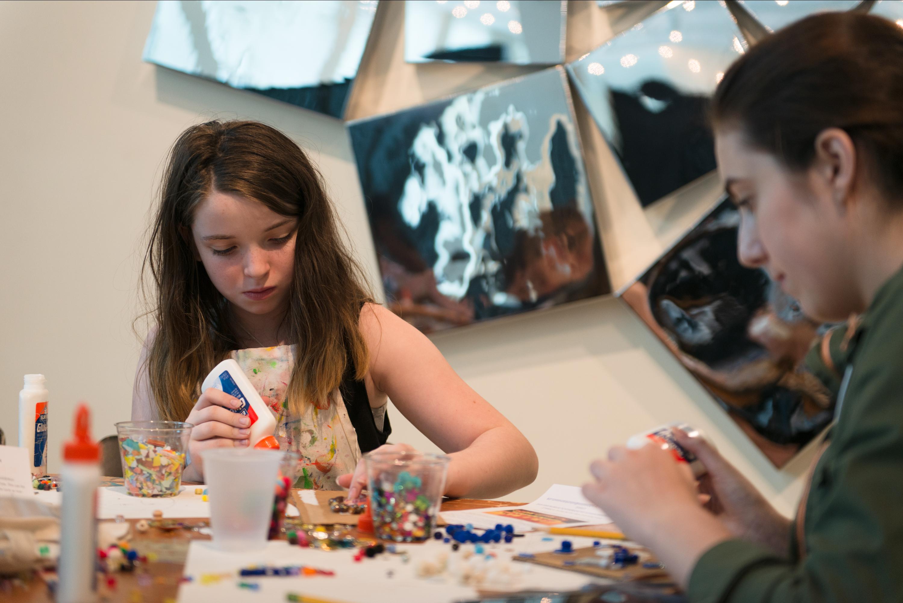 campers assemble found objects to create art